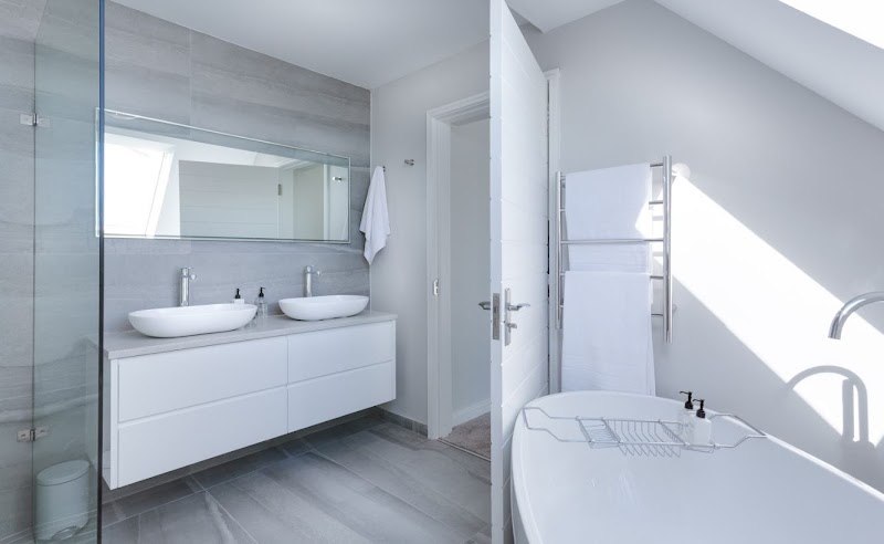 Modern bathroom renovation with dual basins and freestanding bath